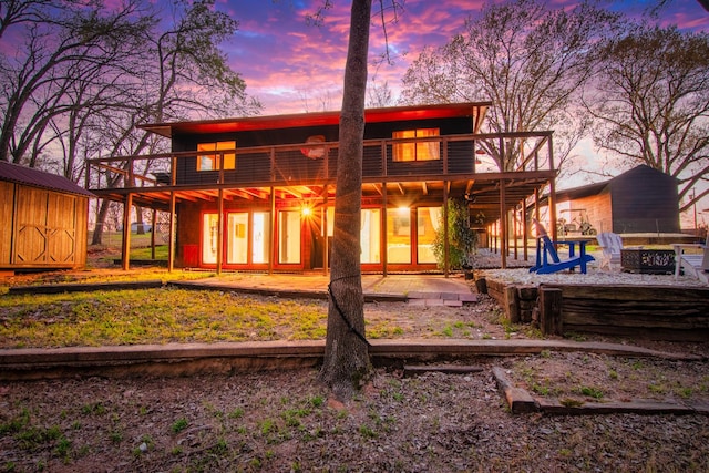 104 Henderson Harbor Cir, Payne Springs, TX 75156 - back of house with a fire pit, a patio area, and a wooden deck