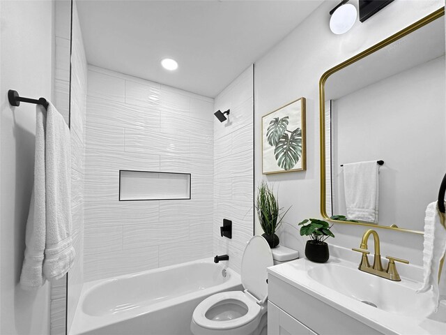 bathroom with shower / tub combination, toilet, and vanity