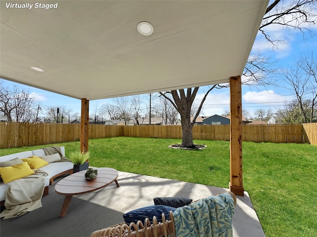 view of patio / terrace with an outdoor hangout area and a fenced backyard