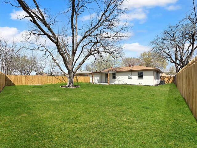 view of yard with a fenced backyard