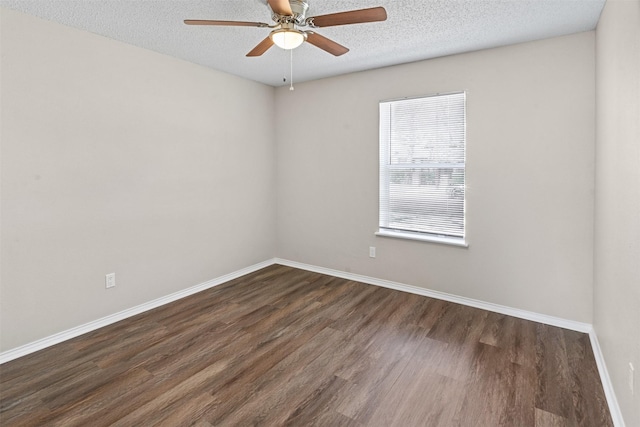 1505 W Collin, Corsicana, TX 75110 - unfurnished room featuring dark wood finished floors, ceiling fan, a textured ceiling, and baseboards