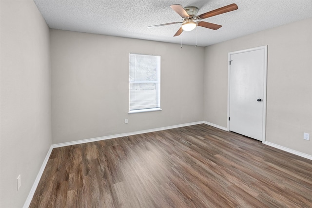 1505 W Collin, Corsicana, TX 75110 - empty room with wood finished floors, a ceiling fan, a textured ceiling, and baseboards