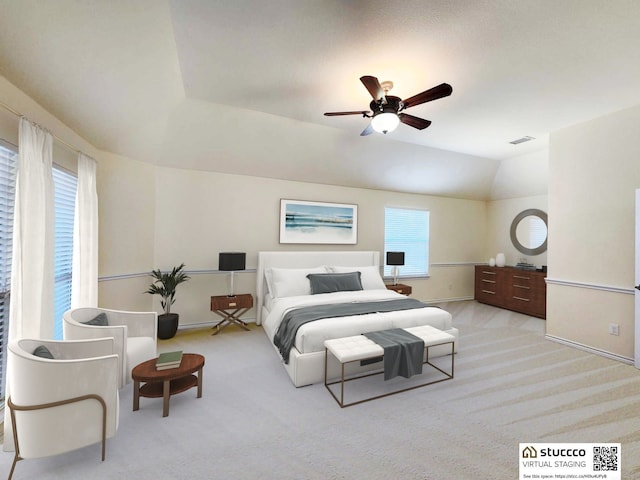 carpeted bedroom featuring ceiling fan, baseboards, lofted ceiling, and visible vents