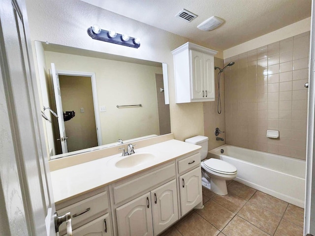 bathroom featuring tile patterned floors, visible vents, toilet, vanity, and  shower combination