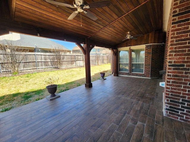 view of patio featuring a fenced backyard, a wooden deck, and ceiling fan