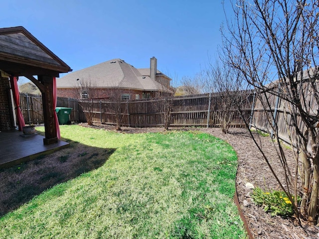 view of yard with a fenced backyard
