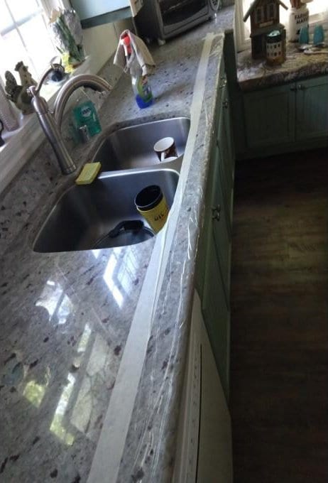 details featuring a sink and wood finished floors