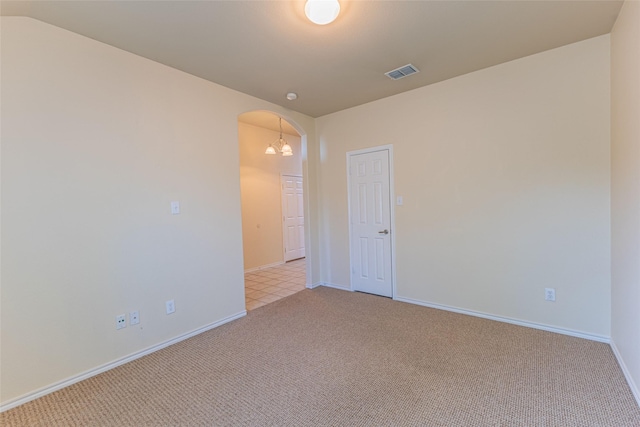 1032 Bending Oak Dr, Cedar Hill, TX 75104 - spare room featuring light carpet, arched walkways, and baseboards