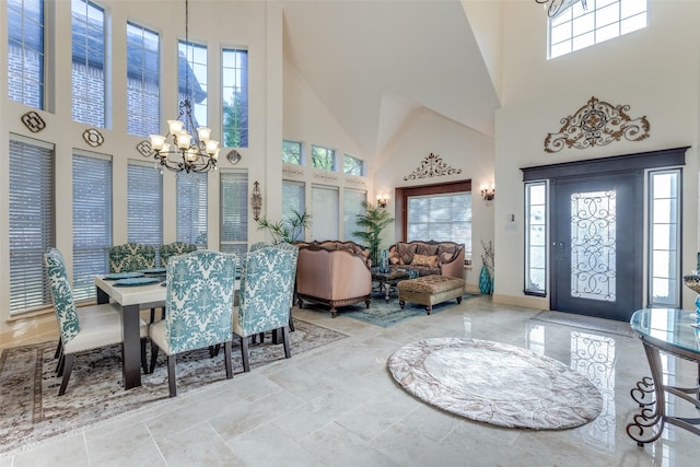 12252 Skipper Dr, Frisco, TX 75035 - foyer entrance with a chandelier, a towering ceiling, and baseboards