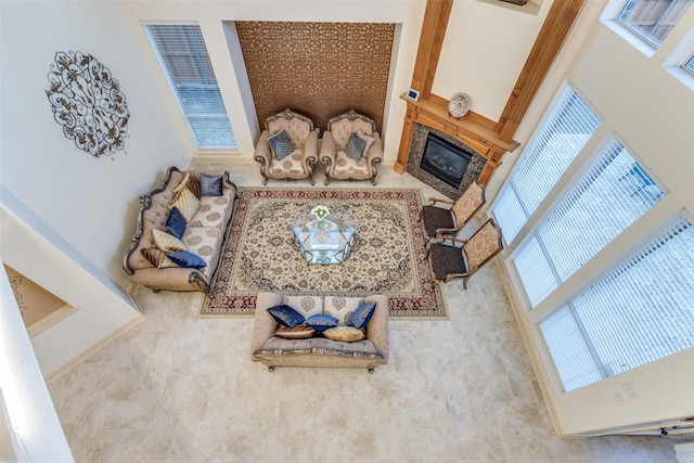 12252 Skipper Dr, Frisco, TX 75035 - living area with a glass covered fireplace and a towering ceiling