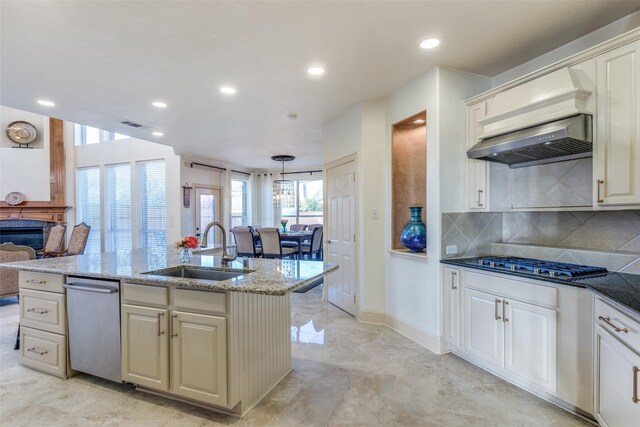 12252 Skipper Dr, Frisco, TX 75035 - kitchen featuring a sink, appliances with stainless steel finishes, decorative backsplash, recessed lighting, and a kitchen island with sink