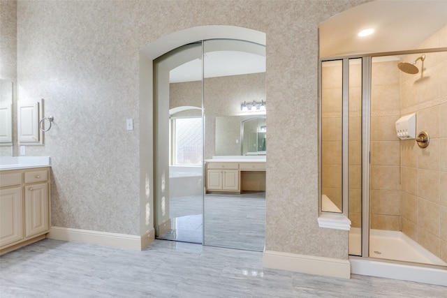 12252 Skipper Dr, Frisco, TX 75035 - bathroom with a stall shower, vanity, and baseboards