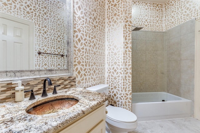 12252 Skipper Dr, Frisco, TX 75035 - bathroom featuring toilet, vanity,  shower combination, tasteful backsplash, and wallpapered walls
