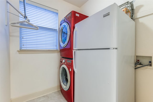 12252 Skipper Dr, Frisco, TX 75035 - laundry area featuring stacked washer / dryer and baseboards