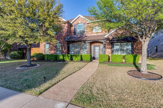 12252 Skipper Dr, Frisco, TX 75035 - traditional-style house featuring brick siding and a front lawn