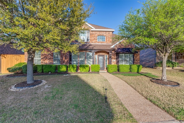 12252 Skipper Dr, Frisco, TX 75035 - traditional-style home featuring brick siding and a front yard