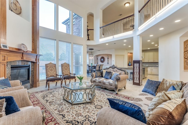 12252 Skipper Dr, Frisco, TX 75035 - living room featuring a towering ceiling, plenty of natural light, a fireplace, and recessed lighting