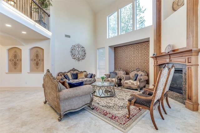12252 Skipper Dr, Frisco, TX 75035 - living room with high vaulted ceiling, a high end fireplace, and baseboards