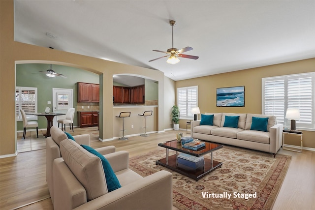 11279 Snyder Dr, Frisco, TX 75035 - living room with ceiling fan, light wood-style floors, baseboards, and vaulted ceiling