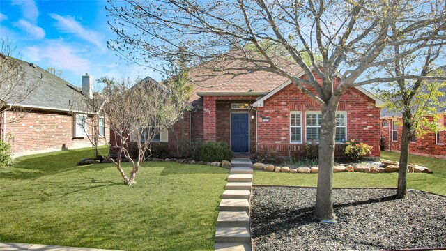 11279 Snyder Dr, Frisco, TX 75035 - view of front facade featuring brick siding, a front lawn, and a chimney