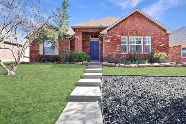 11279 Snyder Dr, Frisco, TX 75035 - view of front of home with brick siding, a front lawn, and roof with shingles