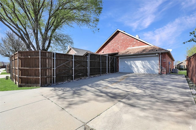 11279 Snyder Dr, Frisco, TX 75035 - view of property exterior featuring brick siding, fence, concrete driveway, and an attached garage
