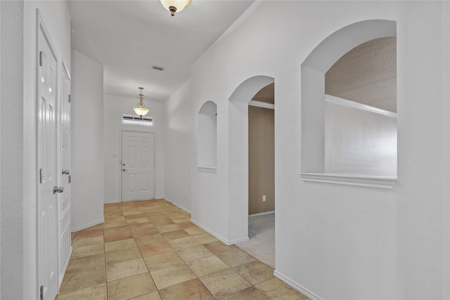 11279 Snyder Dr, Frisco, TX 75035 - hall featuring arched walkways and baseboards