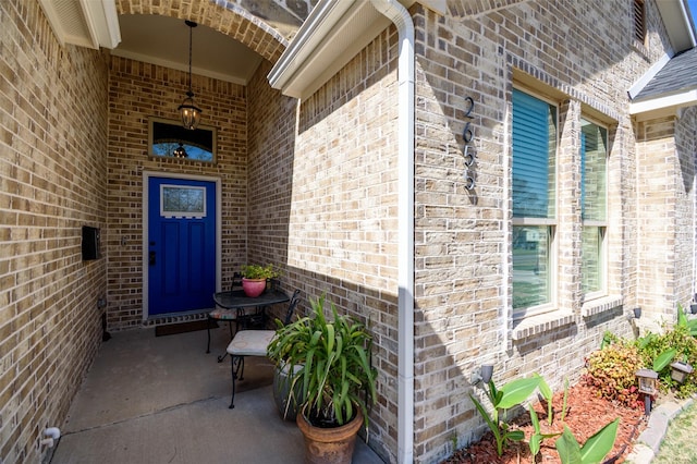 2655 Kathleen Ave, Dallas, TX 75216 - property entrance featuring brick siding and a porch
