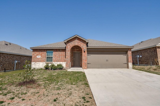 ranch-style home featuring brick siding, driveway, a shingled roof, and a garage