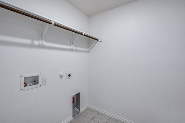 laundry room featuring hookup for a washing machine, baseboards, laundry area, light tile patterned flooring, and electric dryer hookup