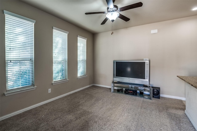 9848 Robinwoods Dr, Frisco, TX 75035 - unfurnished living room featuring carpet, a ceiling fan, and baseboards