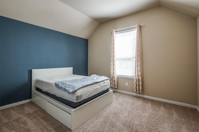 9848 Robinwoods Dr, Frisco, TX 75035 - carpeted bedroom featuring vaulted ceiling, multiple windows, and baseboards