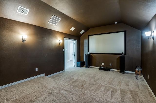 9848 Robinwoods Dr, Frisco, TX 75035 - home theater room with carpet floors, lofted ceiling, and baseboards