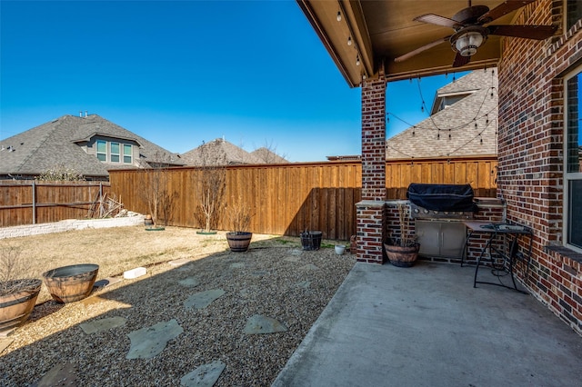 9848 Robinwoods Dr, Frisco, TX 75035 - fenced backyard featuring a ceiling fan and a patio area