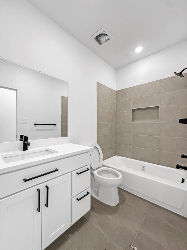 bathroom featuring visible vents, toilet,  shower combination, tile patterned flooring, and vanity
