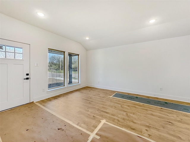 foyer entrance with recessed lighting, wood finished floors, baseboards, and vaulted ceiling