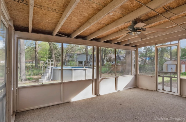 unfurnished sunroom with ceiling fan and a wealth of natural light
