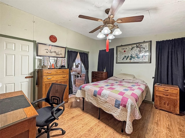 bedroom with a ceiling fan and light wood finished floors