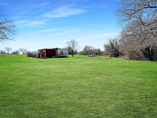 view of yard with an outdoor structure and a pole building