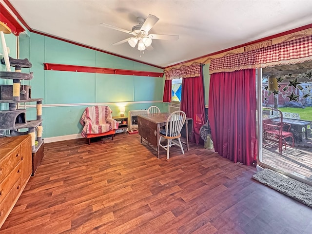 interior space with ceiling fan, wood finished floors, vaulted ceiling, and crown molding