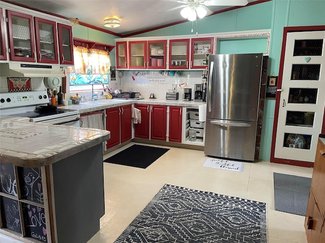 1791 County Road 3855, Poolville, TX 76487 - kitchen with freestanding refrigerator, white range with electric stovetop, under cabinet range hood, a sink, and vaulted ceiling