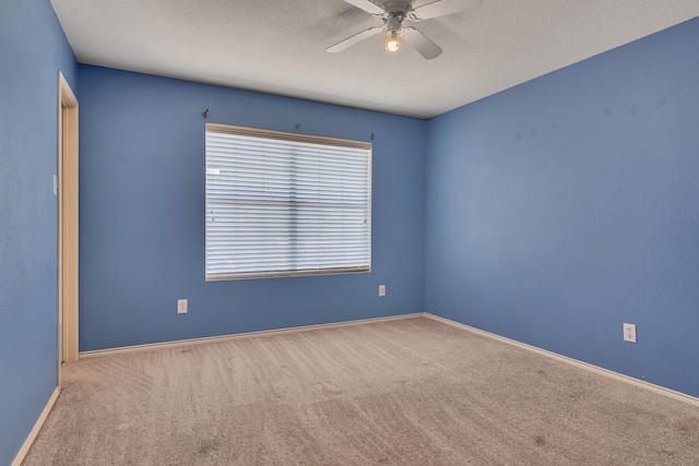 8529 Star Thistle Dr, Fort Worth, TX 76179 - unfurnished room with baseboards, carpet flooring, a textured ceiling, and ceiling fan