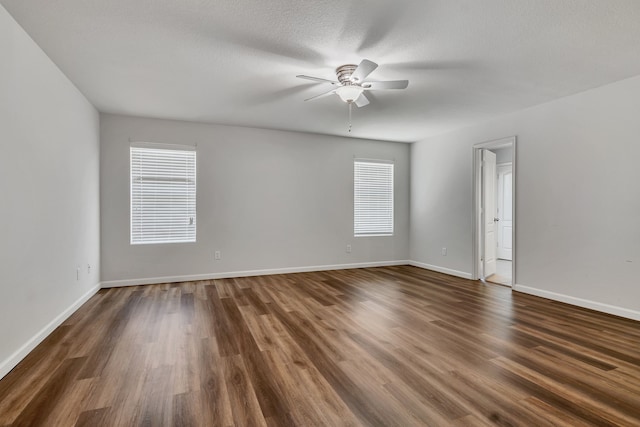 8529 Star Thistle Dr, Fort Worth, TX 76179 - spare room featuring dark wood finished floors, a textured ceiling, baseboards, and ceiling fan