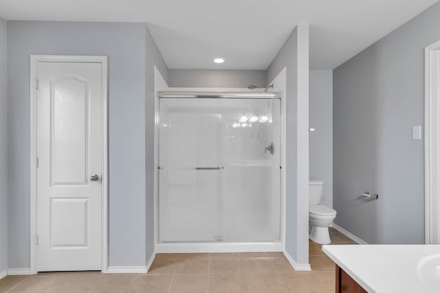 8529 Star Thistle Dr, Fort Worth, TX 76179 - bathroom featuring tile patterned flooring, baseboards, toilet, a stall shower, and vanity