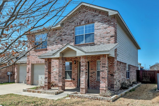 8529 Star Thistle Dr, Fort Worth, TX 76179 - traditional-style house featuring a garage, fence, brick siding, and driveway