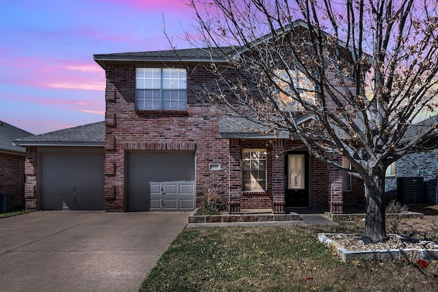 8529 Star Thistle Dr, Fort Worth, TX 76179 - traditional-style house featuring brick siding, central AC unit, driveway, and roof with shingles