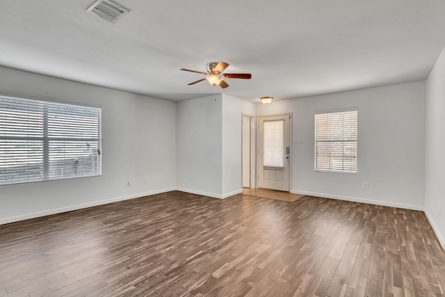 8529 Star Thistle Dr, Fort Worth, TX 76179 - empty room with ceiling fan, visible vents, baseboards, and dark wood finished floors