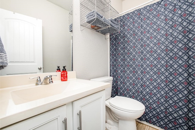 2015 Brenham Dr, Forney, TX 75126 - bathroom with vanity, toilet, a shower with shower curtain, and wood finished floors