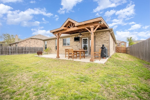2015 Brenham Dr, Forney, TX 75126 - back of house with a ceiling fan, a patio area, and brick siding