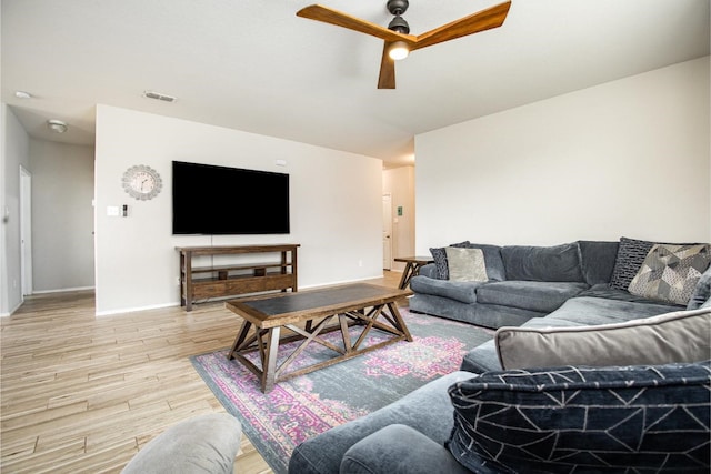 2015 Brenham Dr, Forney, TX 75126 - living room with light wood-type flooring, a ceiling fan, and baseboards